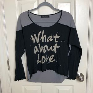 The Clas-sic “What about Love” Distressed Top